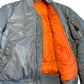 Repaired Military MA-1 Style Jacket Silver Nylon Reversible Orange lining [0012]